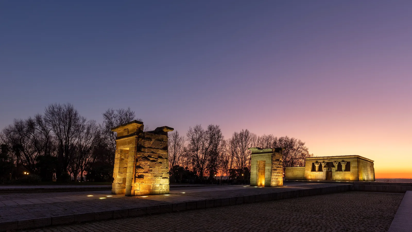 Ancient Egyptian temple gateway and shrine reflected in a pool, Madrid park