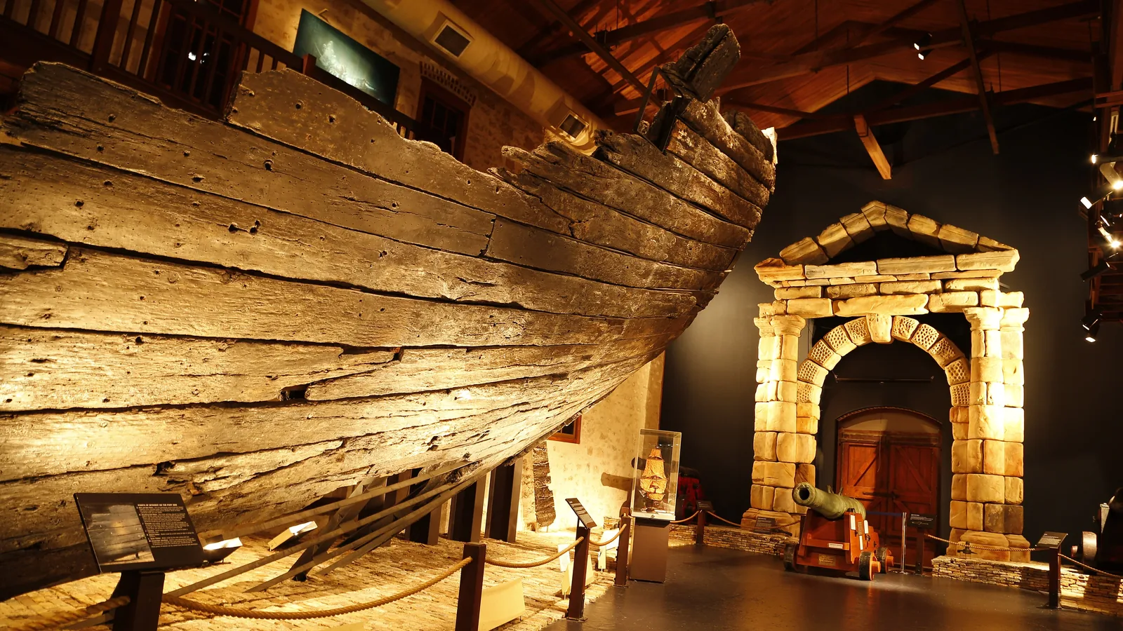 Reconstructed wooden stern section of the Batavia ship displayed in a museum gallery