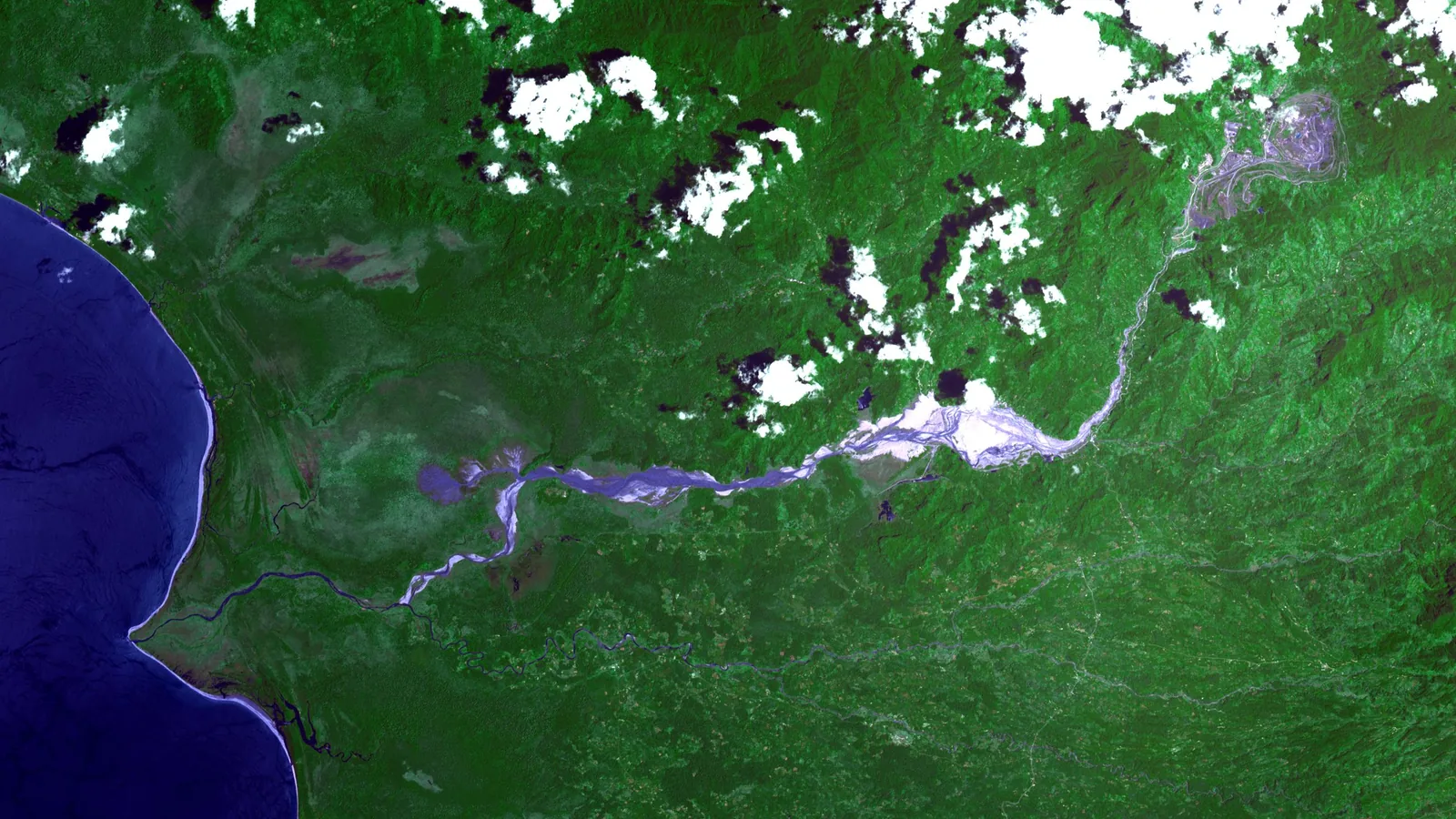 Satellite view of the huge open Panguna copper mine pit cut into Bougainville's hills