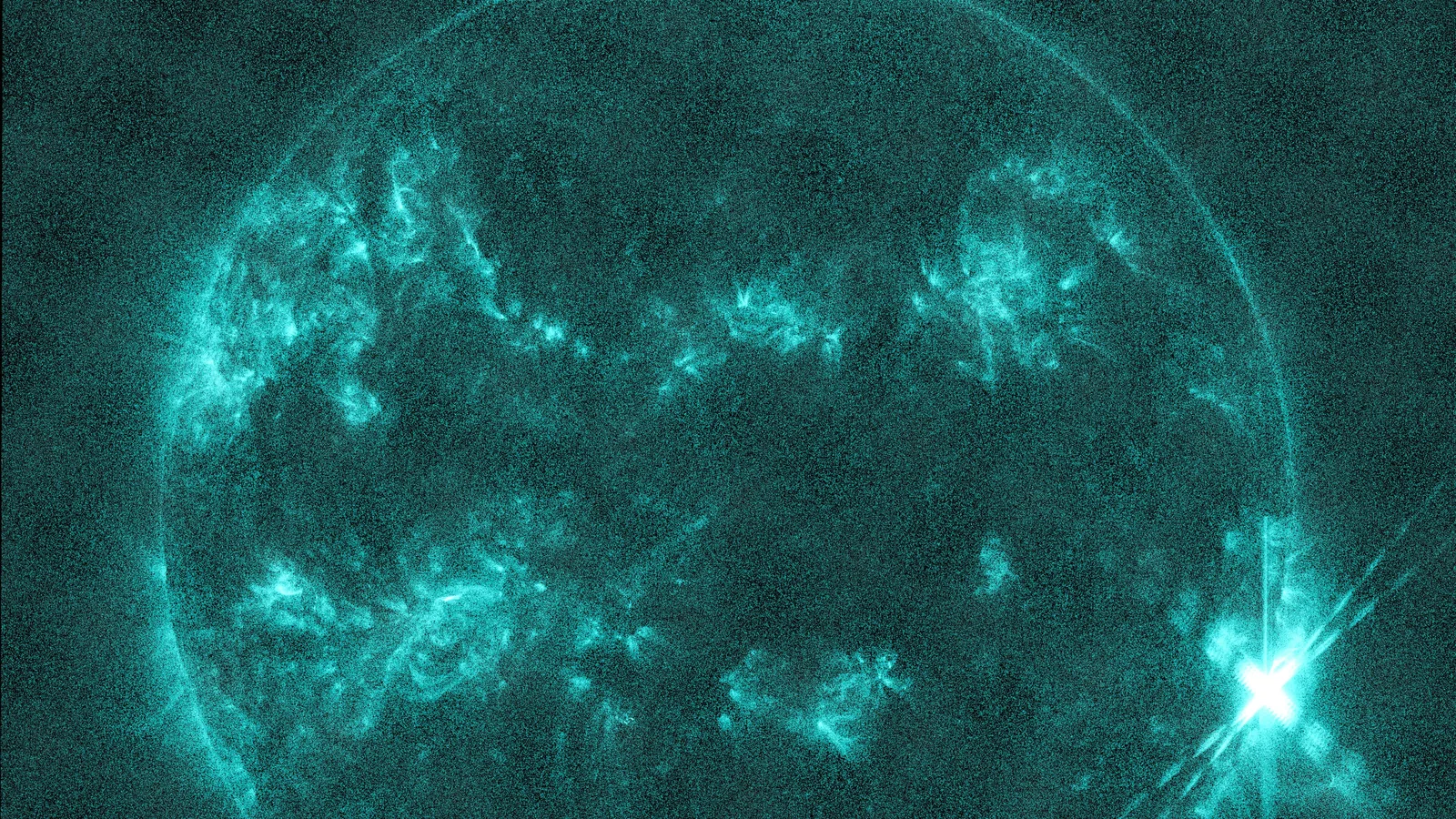 Modern telescope image of the sun showing a bright solar flare at its edge