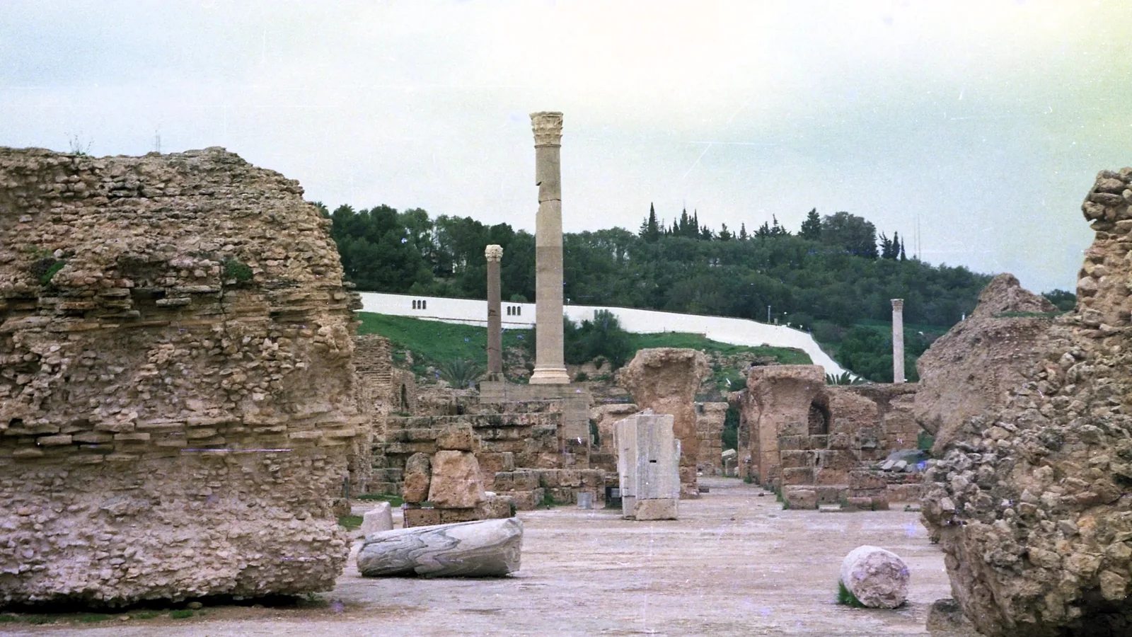 Standing column and low ruin walls of the Roman-era Antonine Baths at Carthage