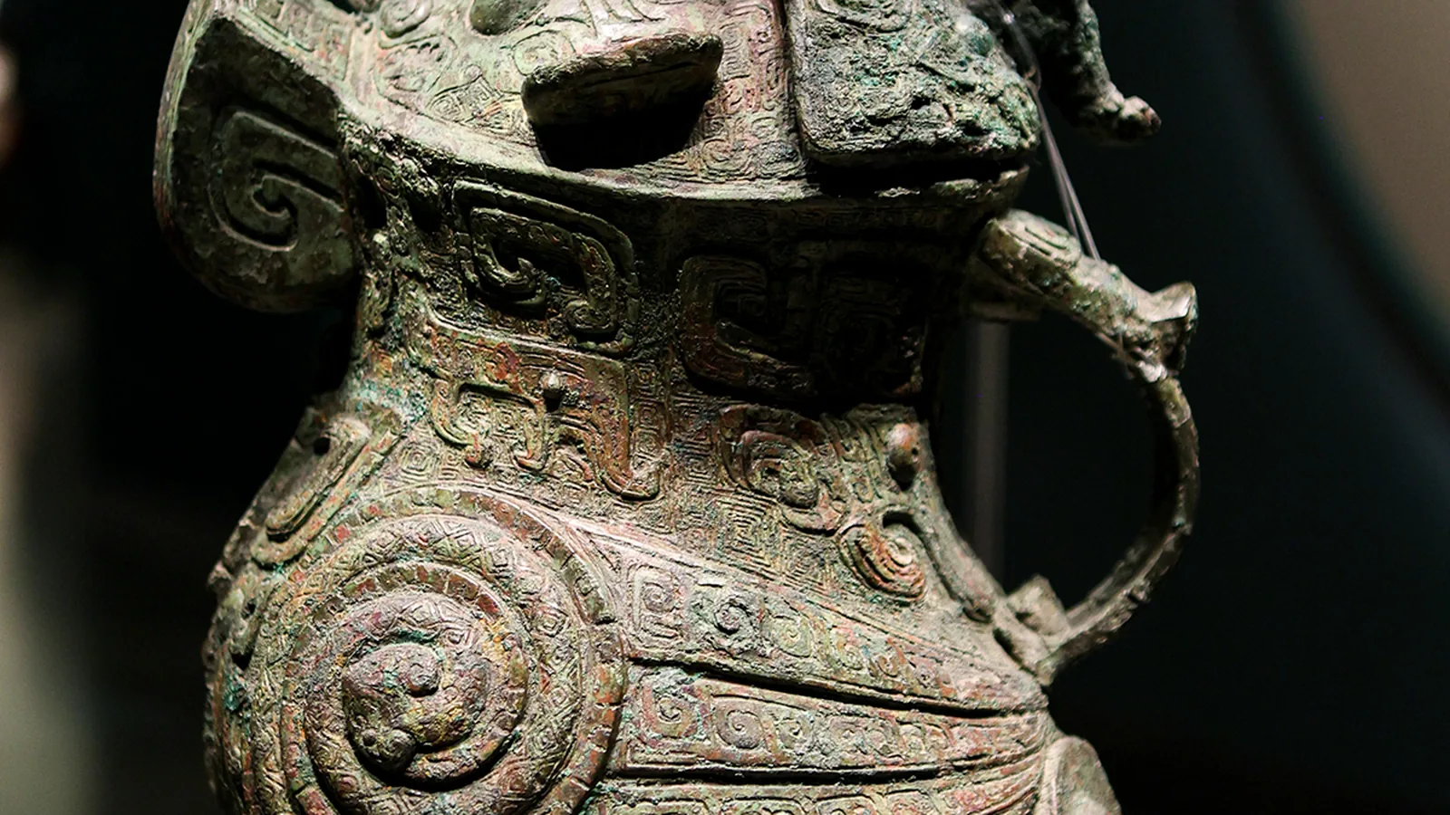 Bronze owl-shaped ritual wine vessel with an inscription on its base