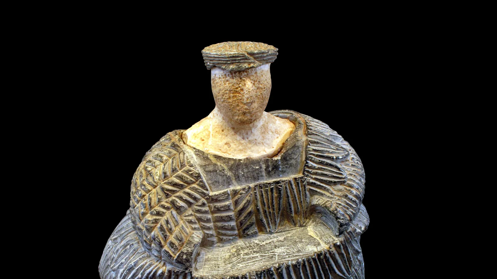Composite stone and limestone seated female figurine, a Bactria-Margiana 'princess'