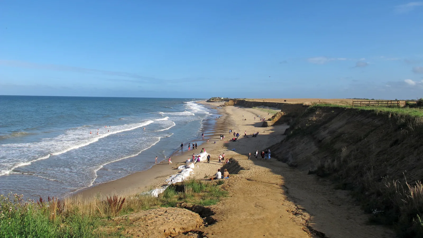 Eroding cliffs and beach at Happisburgh, Norfolk, England
