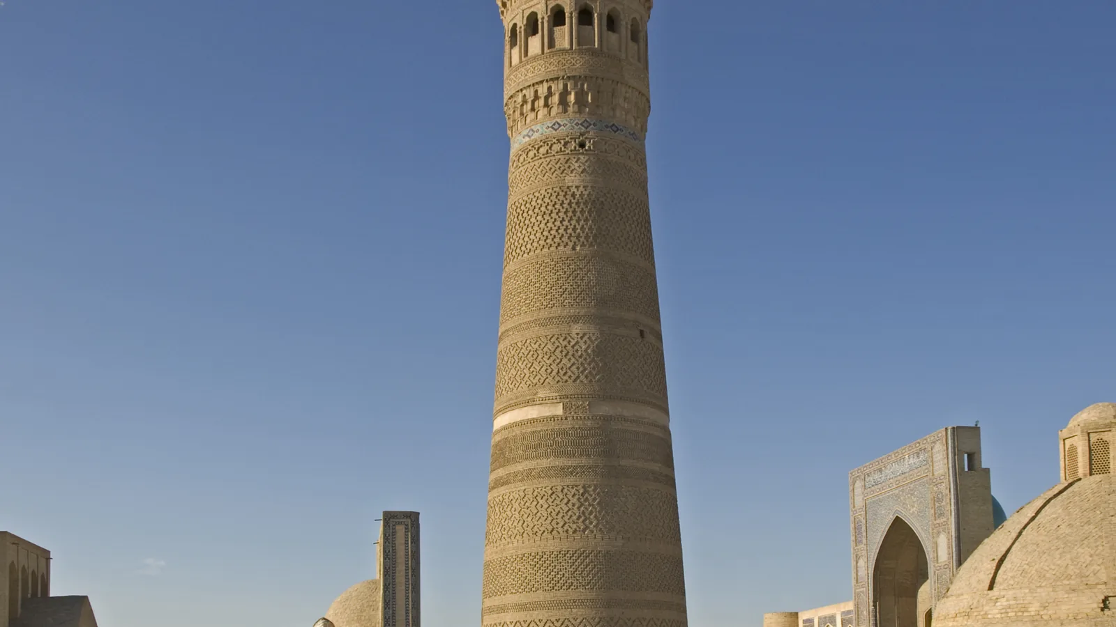 The tall cylindrical brick Kalyan minaret of Bukhara seen from the south