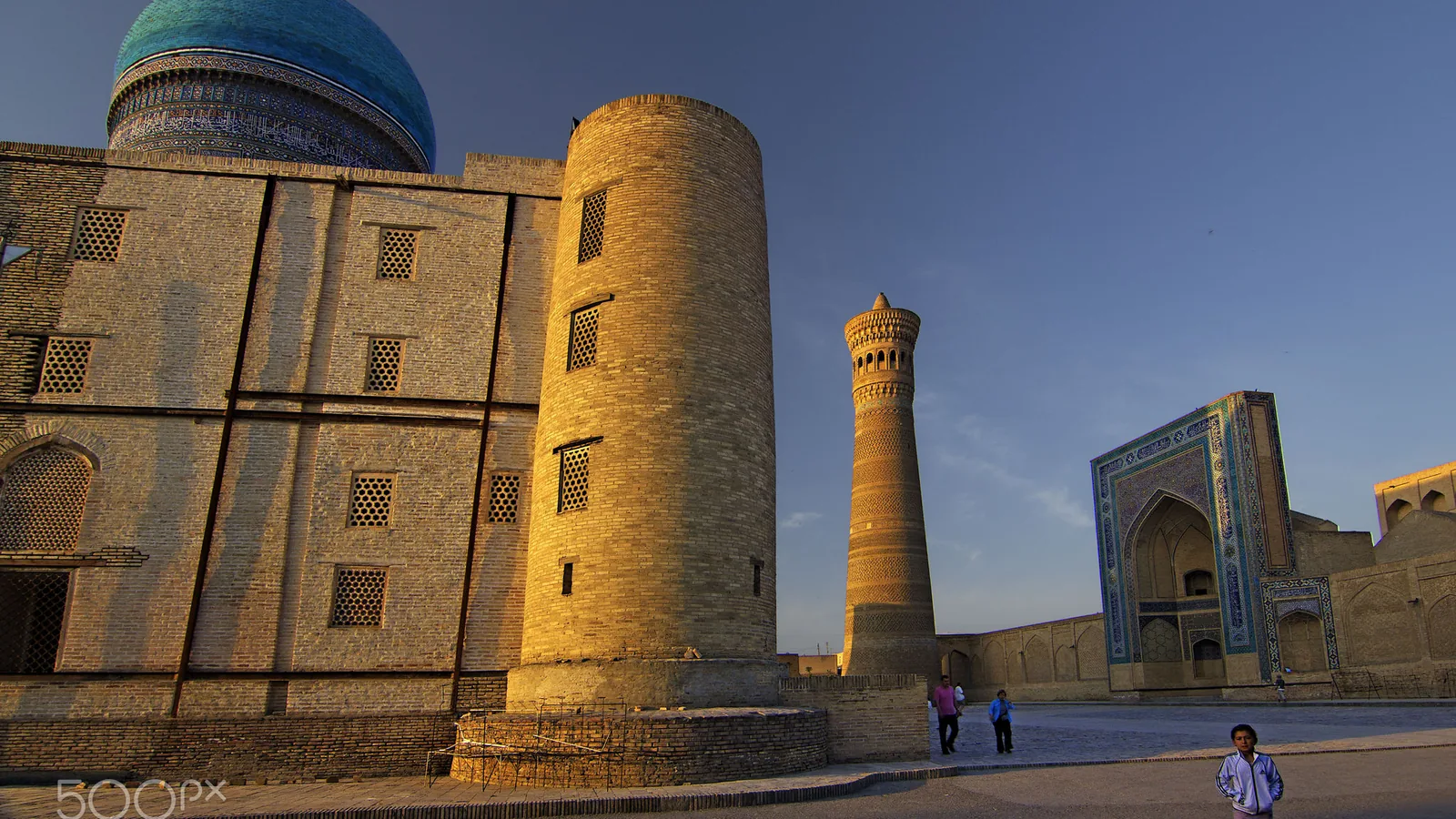 The Kalyan minaret and mosque of the Poi Kalyan ensemble in Bukhara at sunrise