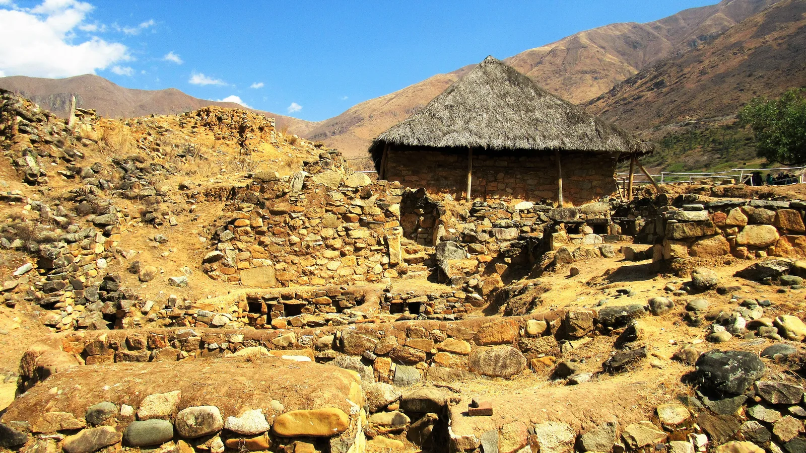 Exterior view of the excavated Temple of the Crossed Hands mound at Kotosh