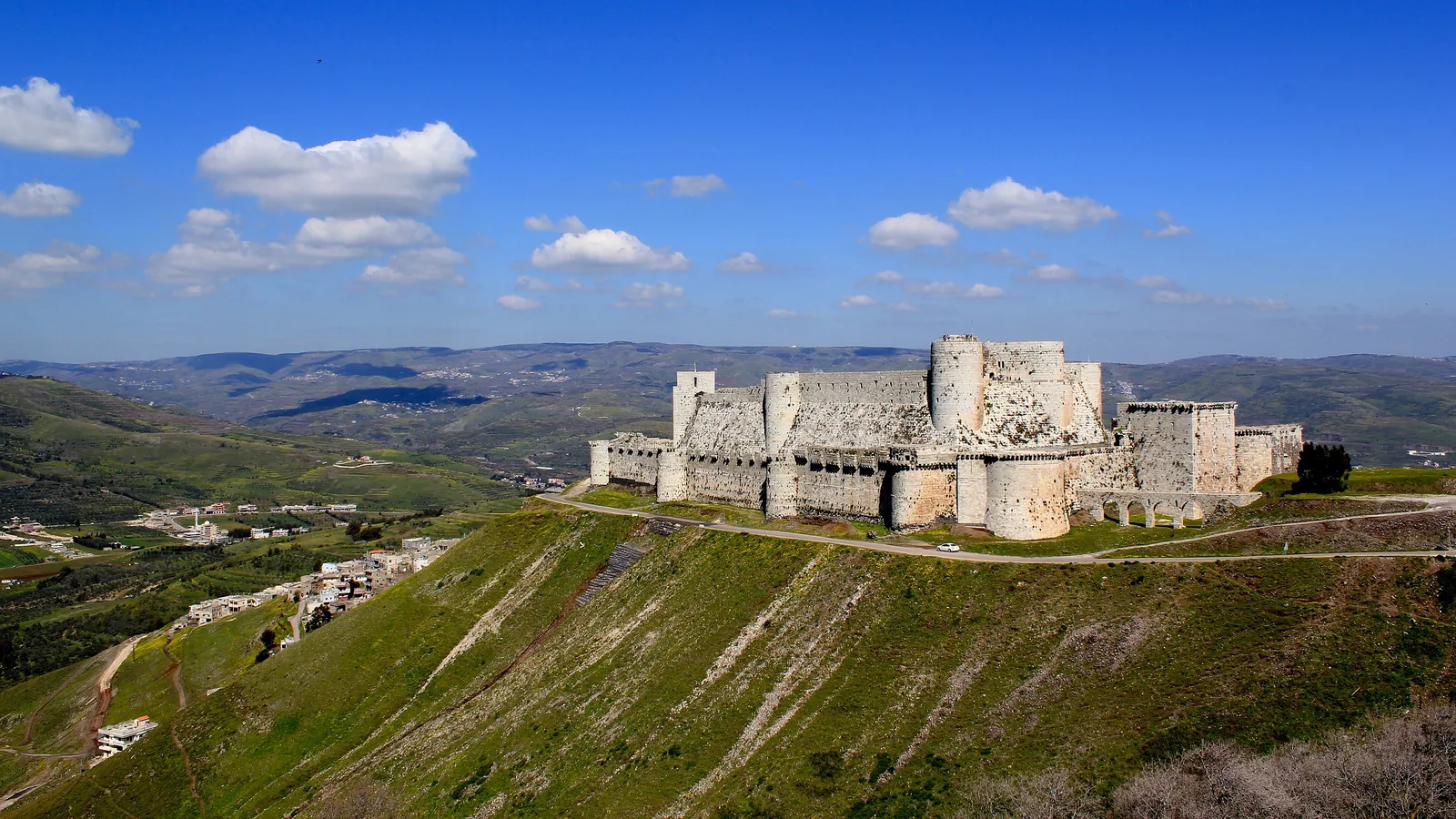 Crusader castle Krak des Chevaliers on a hilltop above the plain of Homs