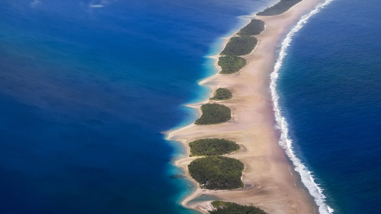 A low coral atoll and lagoon in the Marshall Islands seen from the air