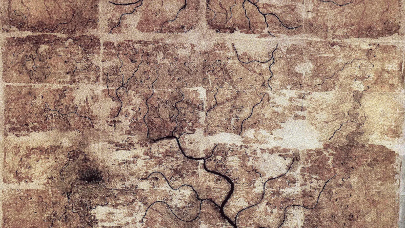 Grid of silk fragments forming a topographic map with black rivers and small settlement marks, south at top