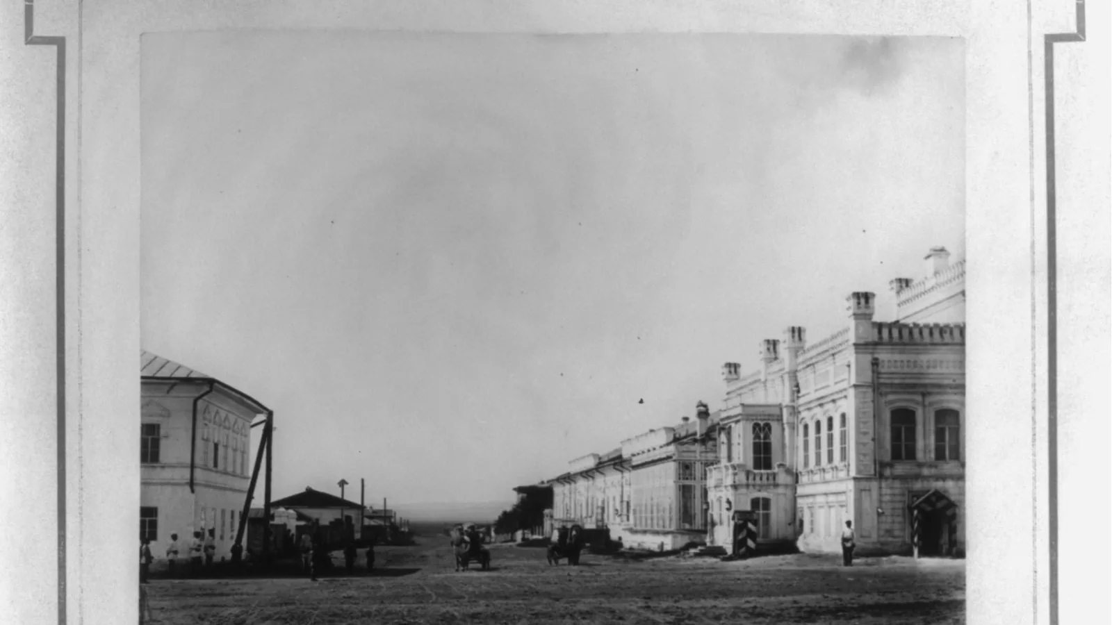A street in Nerchinsk, Siberia, lined with two-story buildings, around 1890