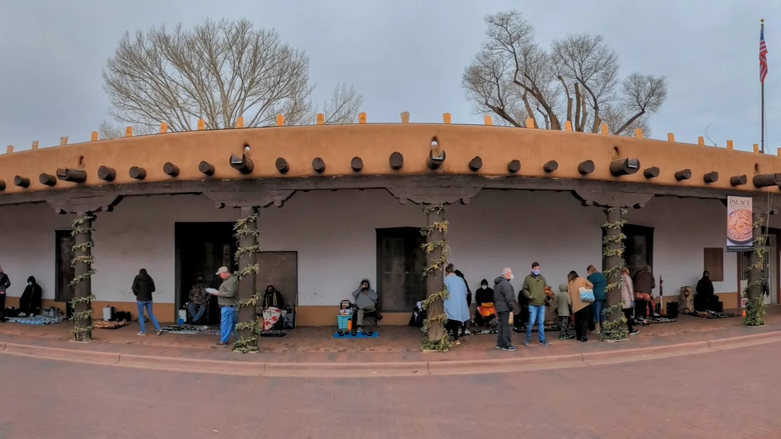 Long adobe colonnaded facade of the Palace of the Governors in Santa Fe