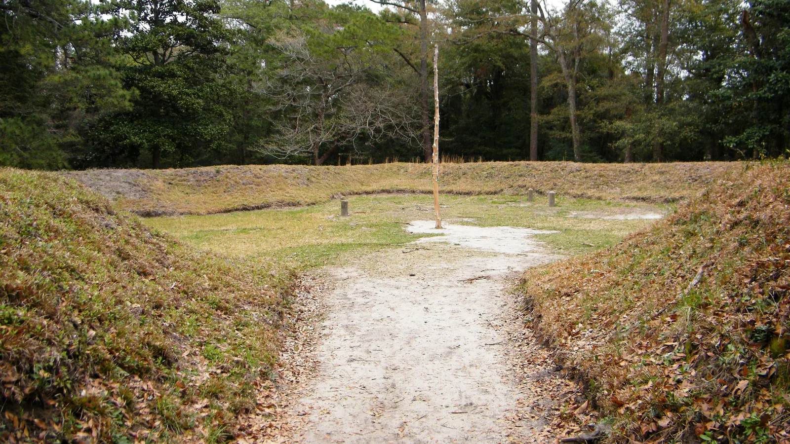 Grass-covered reconstructed earthwork embankments at the Fort Raleigh site