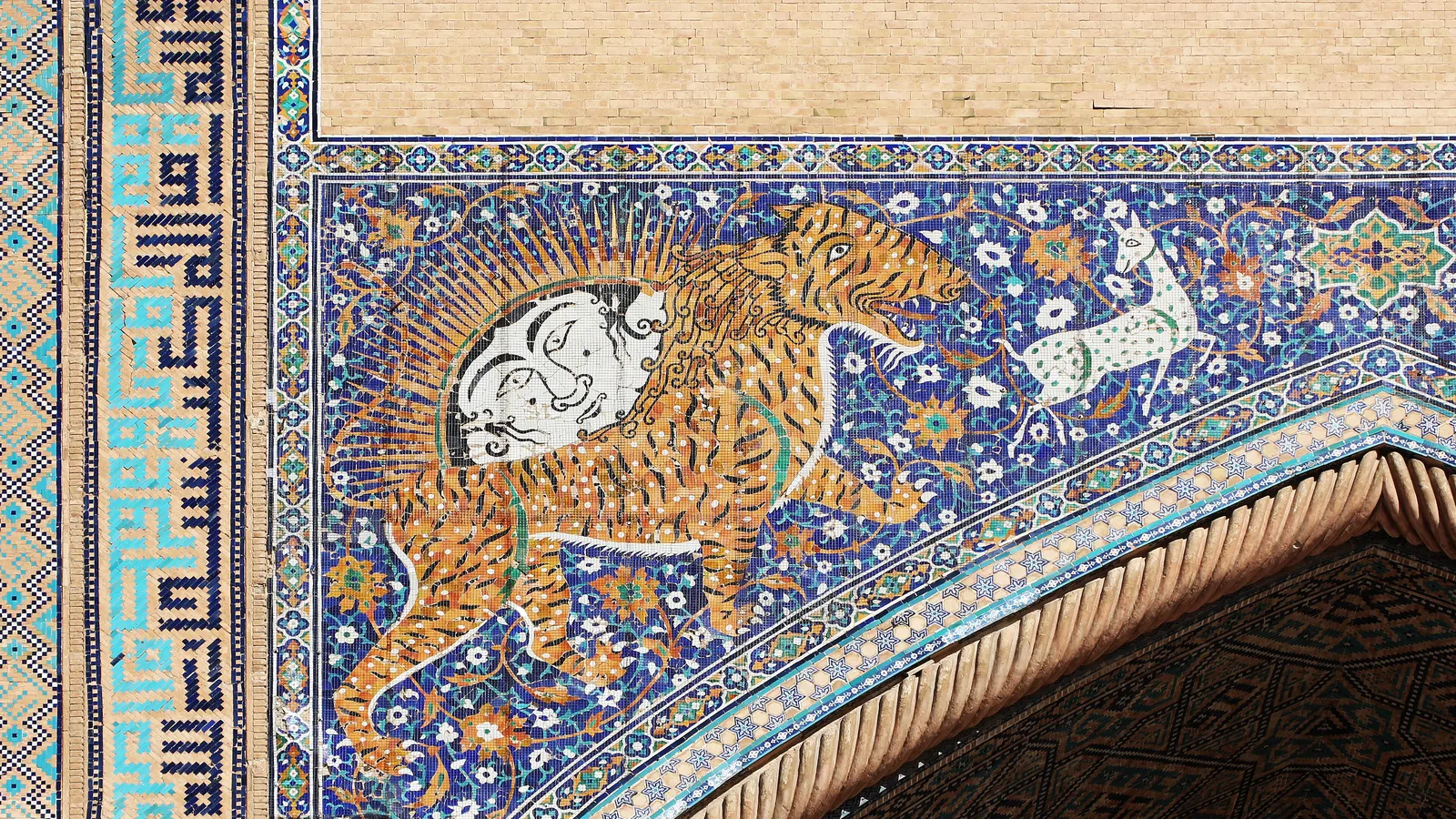 Close view of the tiled portal mosaic on the Sher-Dor madrasa showing the beast and sun design