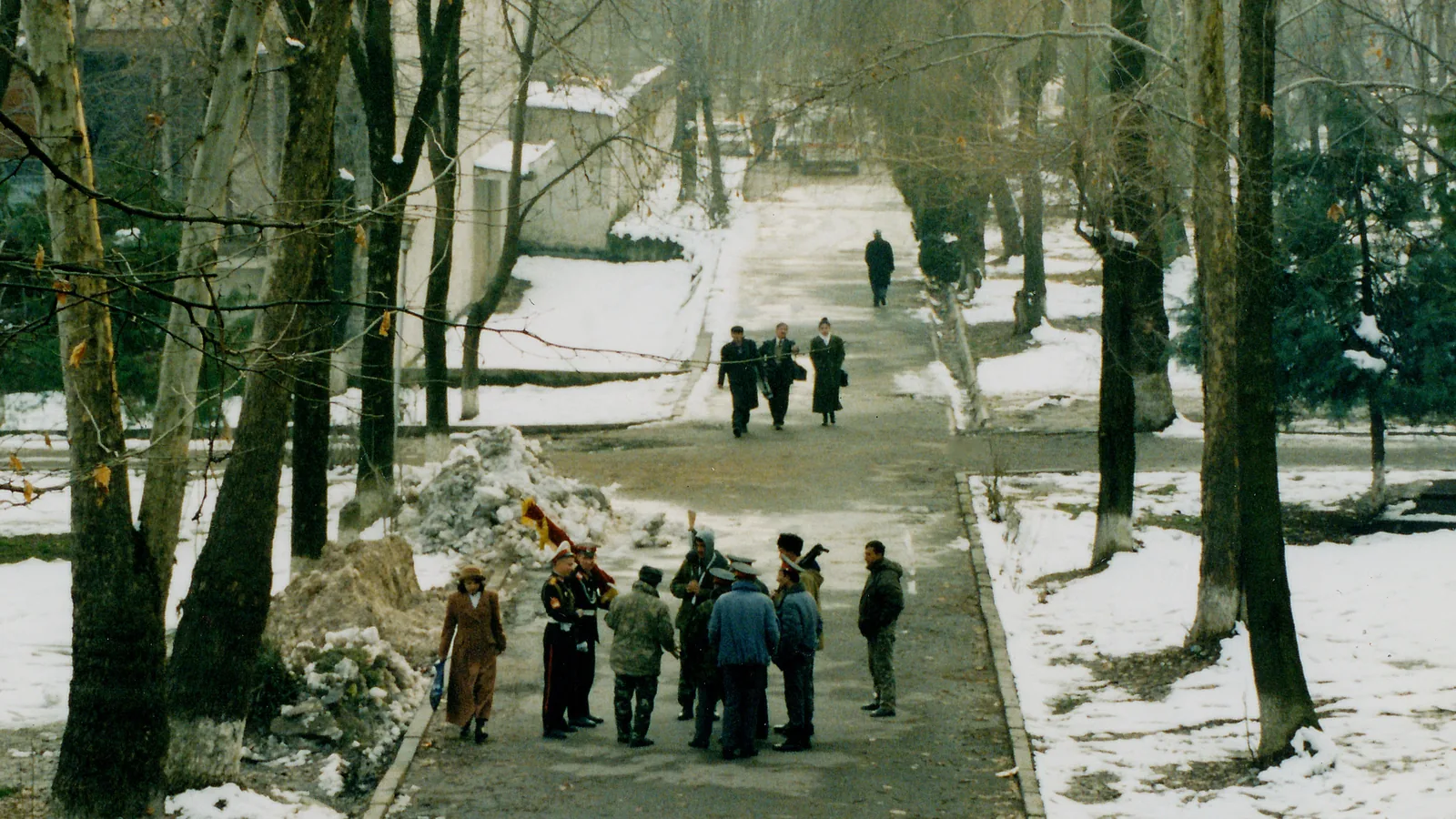A Dushanbe street beside the Opera Ballet Square with people on the sidewalk, December 1997
