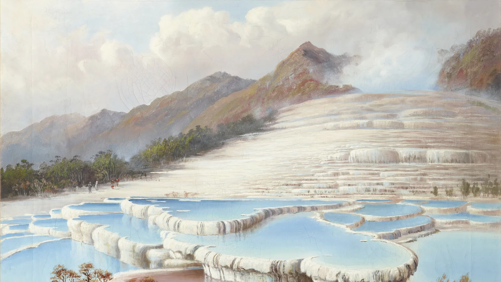 Wide cascading white mineral terraces stepping down to a lake