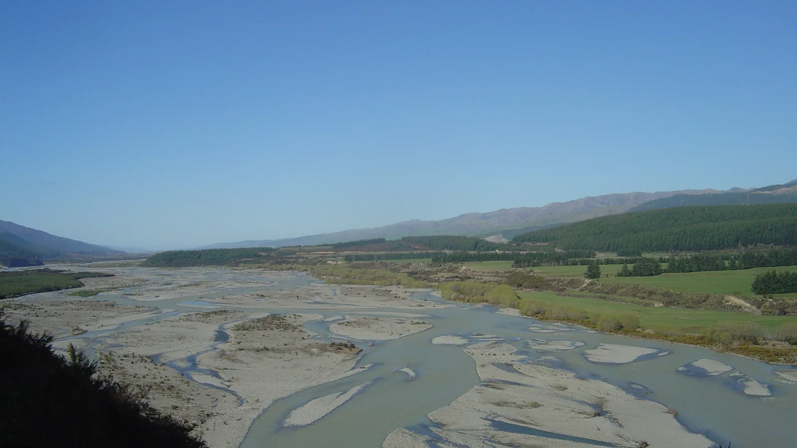 Ground-level view of the Wairau River and its gravel banks in Marlborough, New Zealand